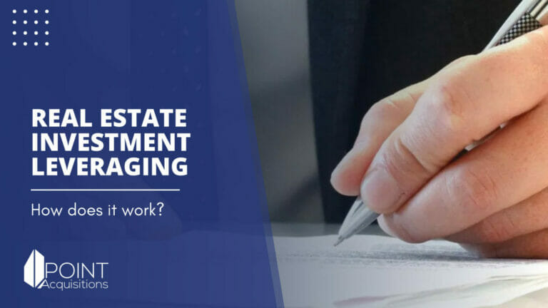 a commercial real estate investor with a pen in their hand writing on a document