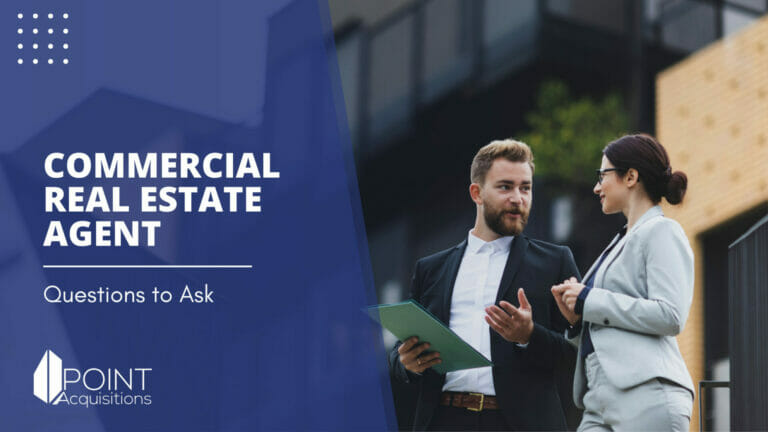 A commercial real estate broker holding a green folder talking to a client who is asking questions to ask a commercial real estate broker