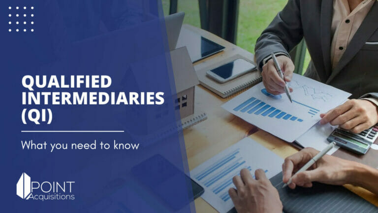 A professional office setting featuring two individuals analyzing financial documents with a laptop and printed data charts. The image is overlaid with text reading "QUALIFIED INTERMEDIARIES (QI) - What you need to know" in bold, white font on a blue background. The Point Acquisitions logo is discreetly placed at the top. This image is designed to visually represent the professional services of a 1031 exchange qualified intermediary.